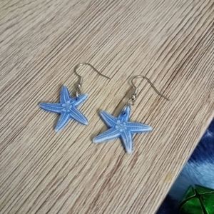 Hand crafted pastel blue statement starfish beach drop earrings